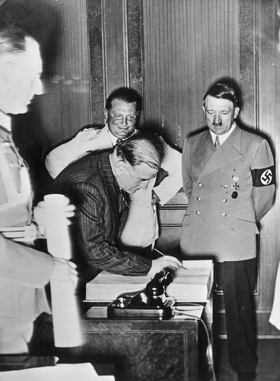 Adolf Hitler with the French prime minister Edouard Daladier signing the Munich agreement after the negotiations